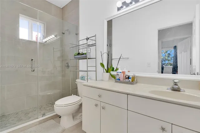 a view of swimming pool with outdoor seating and plants