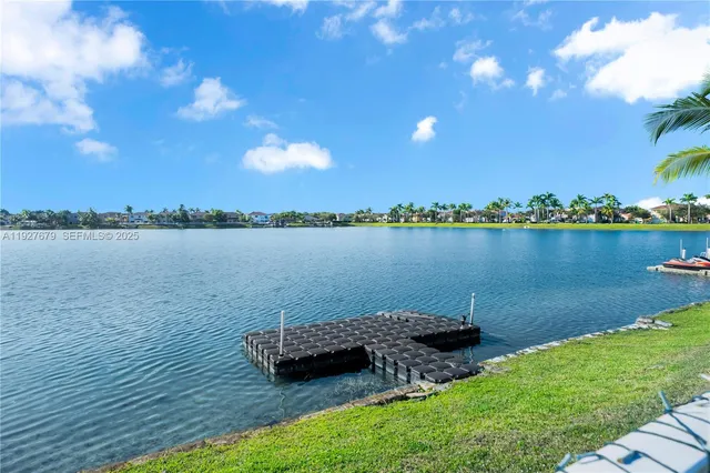 a view of house with swimming pool outdoor seating