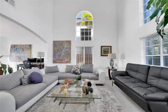 a living room with furniture or couch and a window