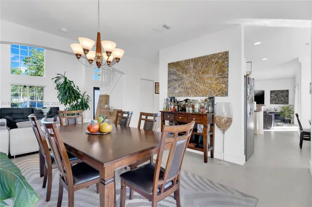 a view of a dining room and chandelier