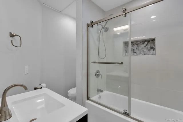 a bathroom with a sink vanity and a mirror