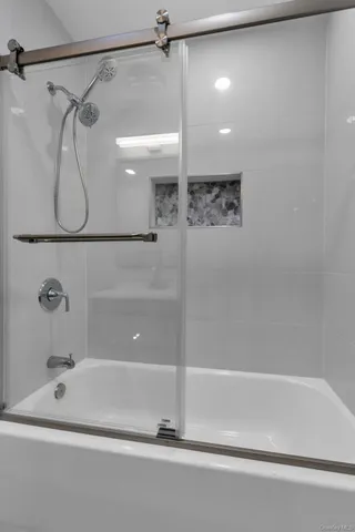 an empty room with a empty space and windows