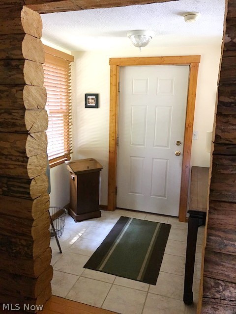 530 Stoner Road Clinton, OH 44216 - Photo 20 of 35 MUD ROOM AREA OFF GARAGE - CERAMIC TILE FLRG - THRU DOOR TO LEFT IS AN ADDL STAIR WAY TO FAM RM ON 2ND FLR
