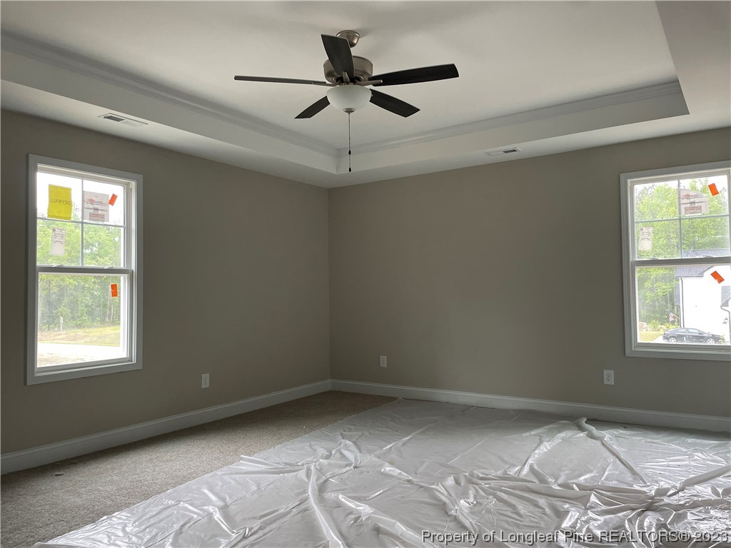 61 Solomon Drive Cameron, NC 28326 - Photo 4 of 7 a view of a livingroom with a ceiling fan and window