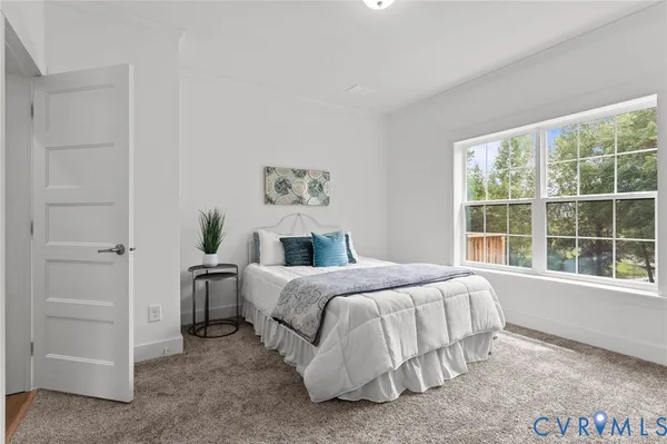 a bedroom with a bed and dresser