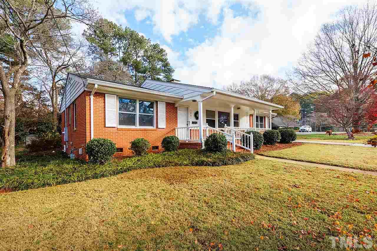 5004 Kaplan Drive Raleigh, NC 27606 - Photo 3 of 30 a front view of a house with a yard