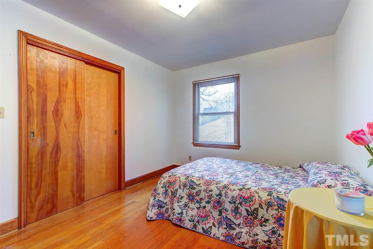 5004 Kaplan Drive Raleigh, NC 27606 - Photo 21 of 30 a bedroom with a bed and a window