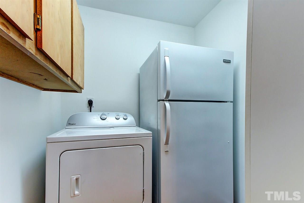 5004 Kaplan Drive Raleigh, NC 27606 - Photo 26 of 30 a utility room with dryer and washer