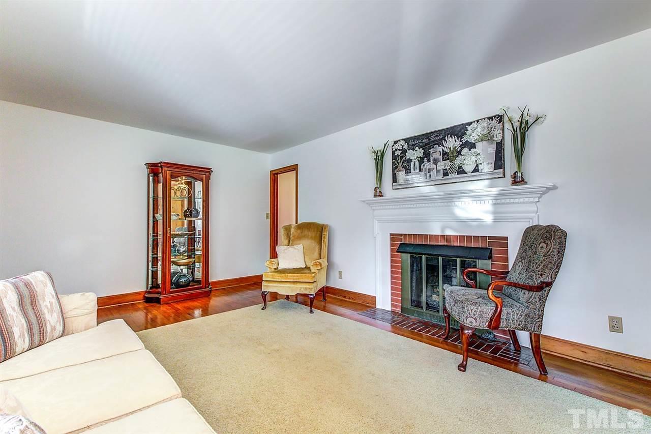 5004 Kaplan Drive Raleigh, NC 27606 - Photo 7 of 30 a living room with furniture and a fireplace