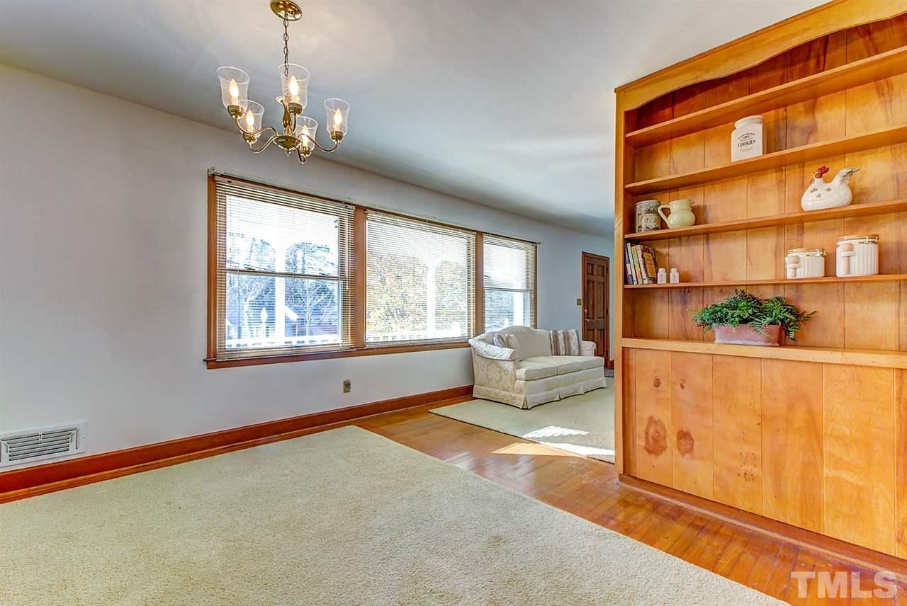 5004 Kaplan Drive Raleigh, NC 27606 - Photo 10 of 30 a living room with a bed furniture and a window