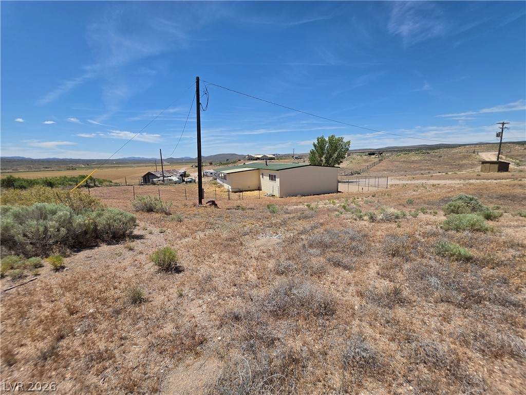 2930 Frehner Ranch Road Pioche, NV 89043 - Photo 17 of 39 A rural landscape featuring a modest structure and broad vistas of the countryside.