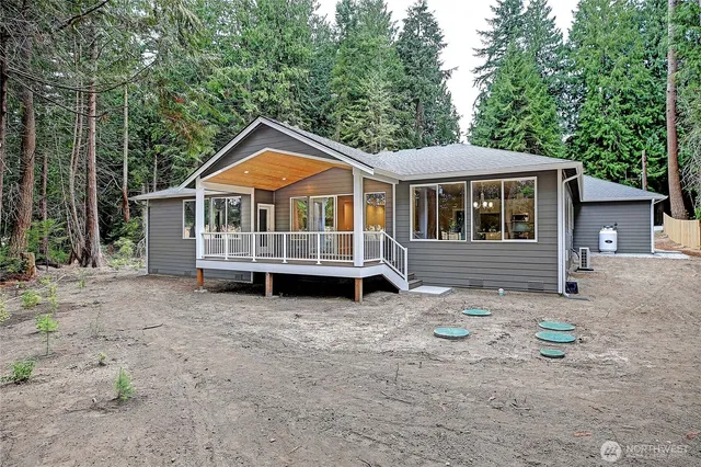 a house with trees in the background