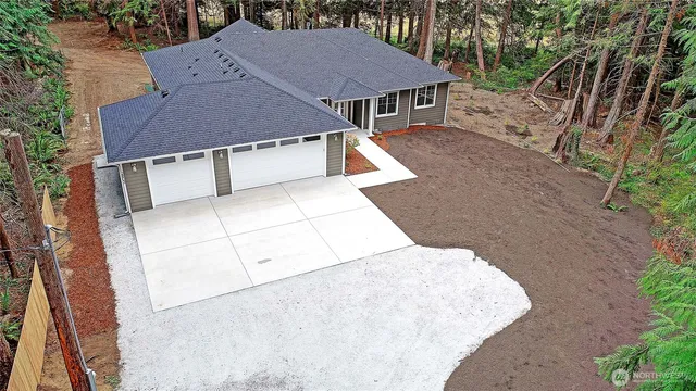 an aerial view of a house with swimming pool