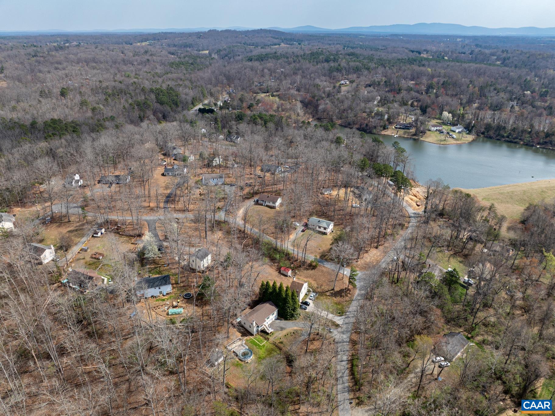 1029 West Daffodil Road Ruckersville, VA 22968 - Photo 8 of 39 a view of a lake with mountains in the background