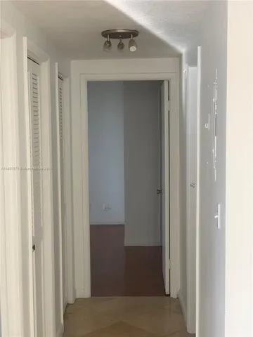 a view of a hallway with closet