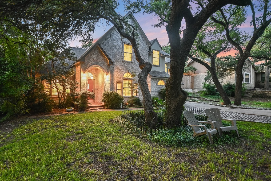 a backyard of a house with outdoor seating