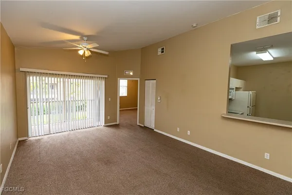 a view of an empty room with a window