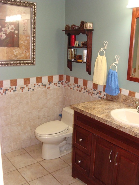 47 Henry Marsh Road Dudley, MA 01571 - Photo 12 of 30 a bathroom with a granite countertop toilet sink and mirror