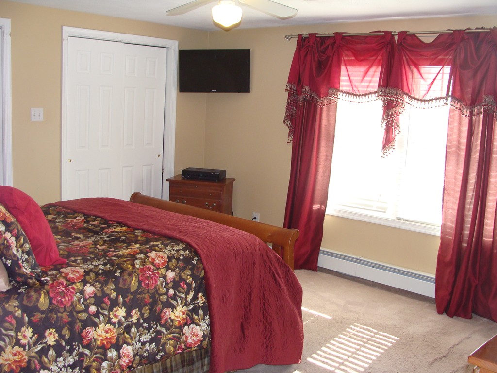 47 Henry Marsh Road Dudley, MA 01571 - Photo 14 of 30 a bedroom with a bed and a window