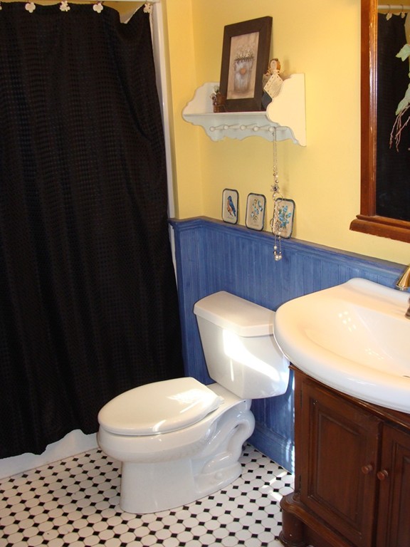 47 Henry Marsh Road Dudley, MA 01571 - Photo 15 of 30 a white toilet sitting next to a bathroom sink