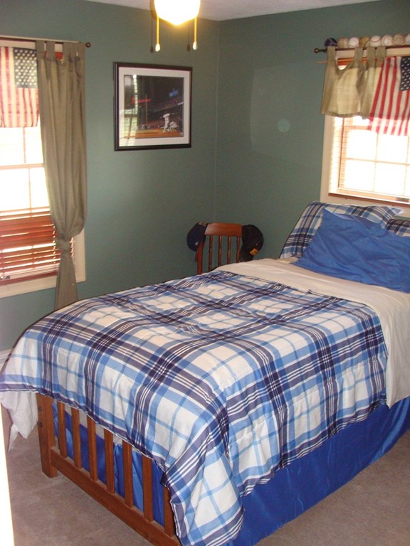 47 Henry Marsh Road Dudley, MA 01571 - Photo 17 of 30 a bedroom with a bed wooden floor and window