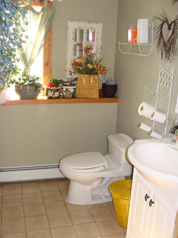 47 Henry Marsh Road Dudley, MA 01571 - Photo 19 of 30 a bathroom with a toilet sink and mirror