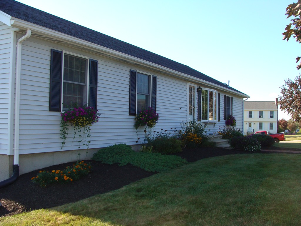 47 Henry Marsh Road Dudley, MA 01571 - Photo 2 of 30 a front view of a house with garden