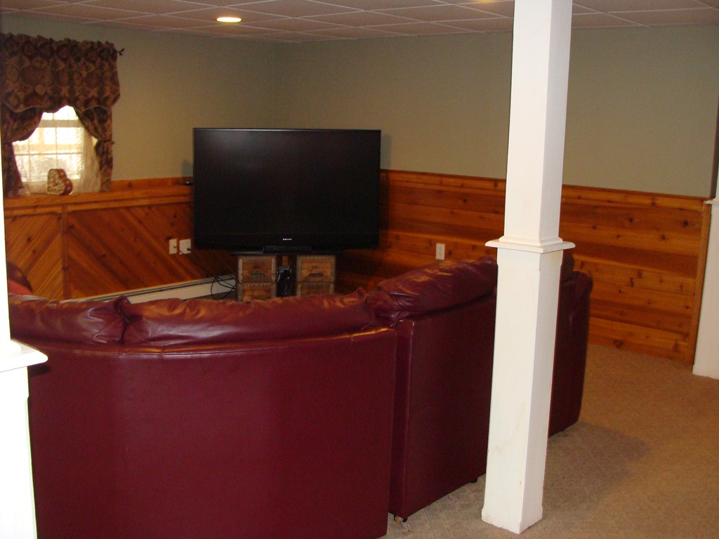 47 Henry Marsh Road Dudley, MA 01571 - Photo 21 of 30 a room with a flat screen tv