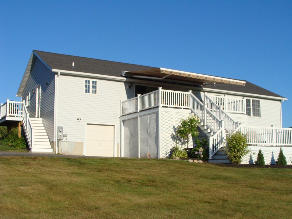 47 Henry Marsh Road Dudley, MA 01571 - Photo 24 of 30 a front view of a house with a yard