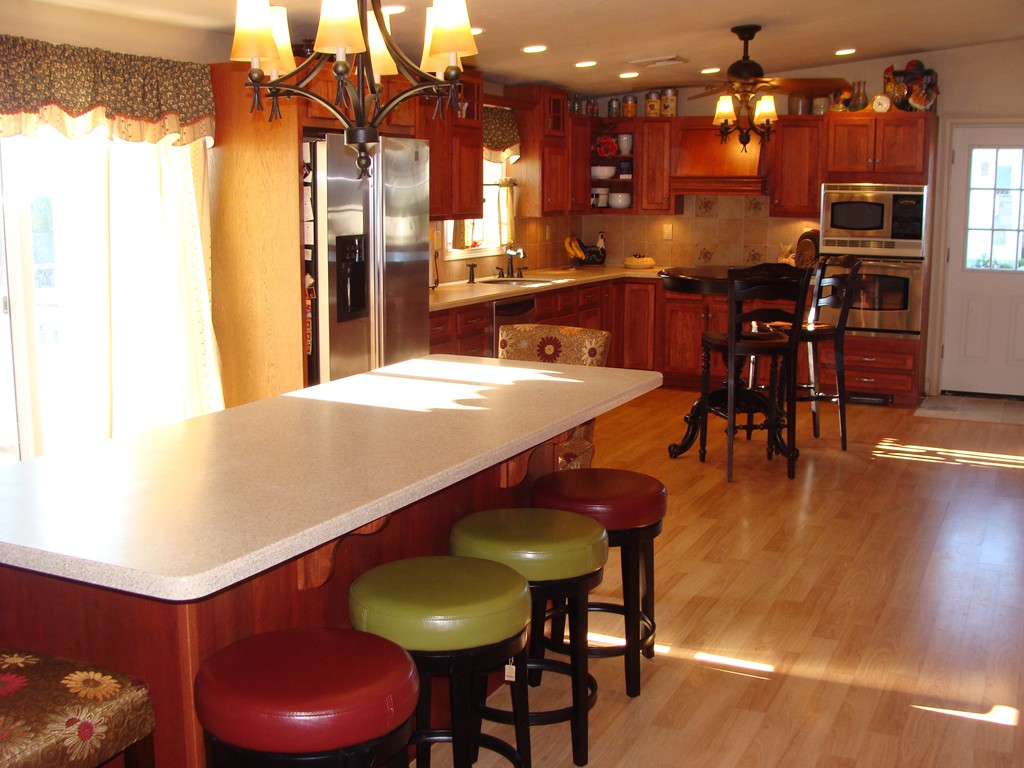 47 Henry Marsh Road Dudley, MA 01571 - Photo 4 of 30 a kitchen with stainless steel appliances a dining table chairs and stove