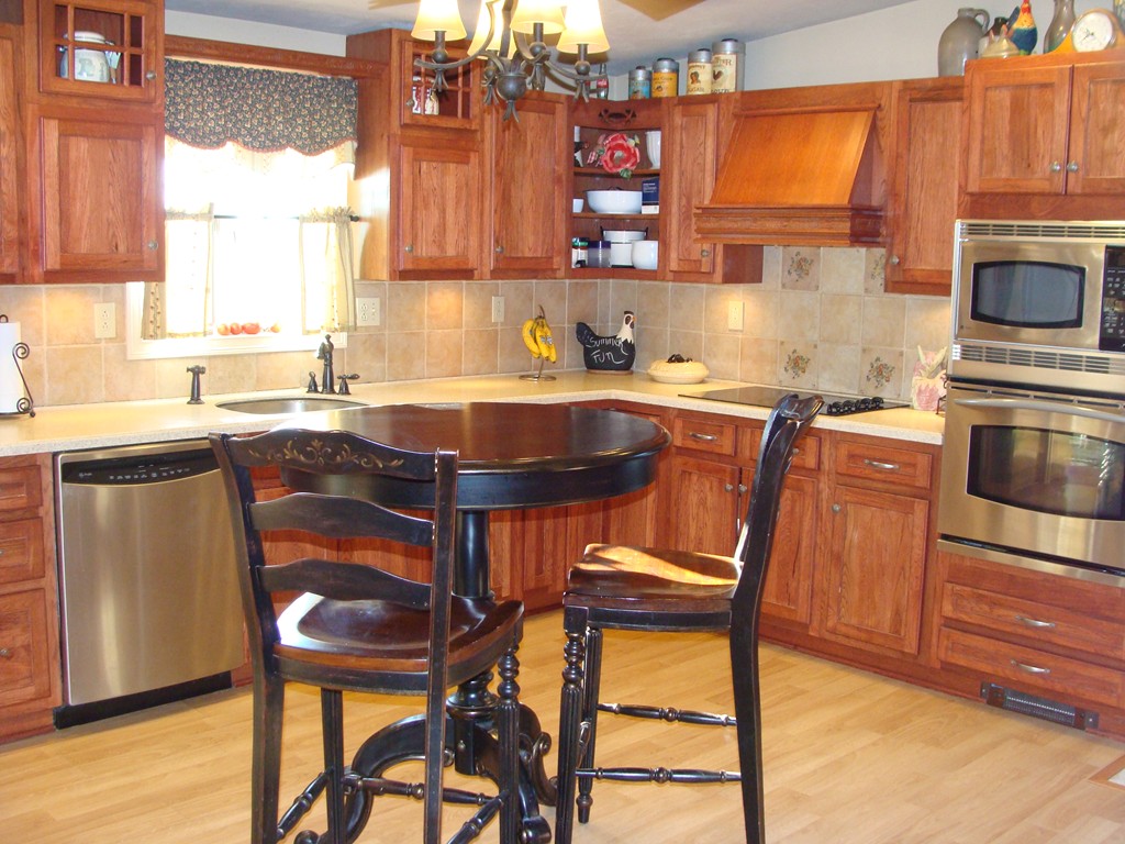 47 Henry Marsh Road Dudley, MA 01571 - Photo 5 of 30 a kitchen with stainless steel appliances granite countertop white cabinets a sink and a stove