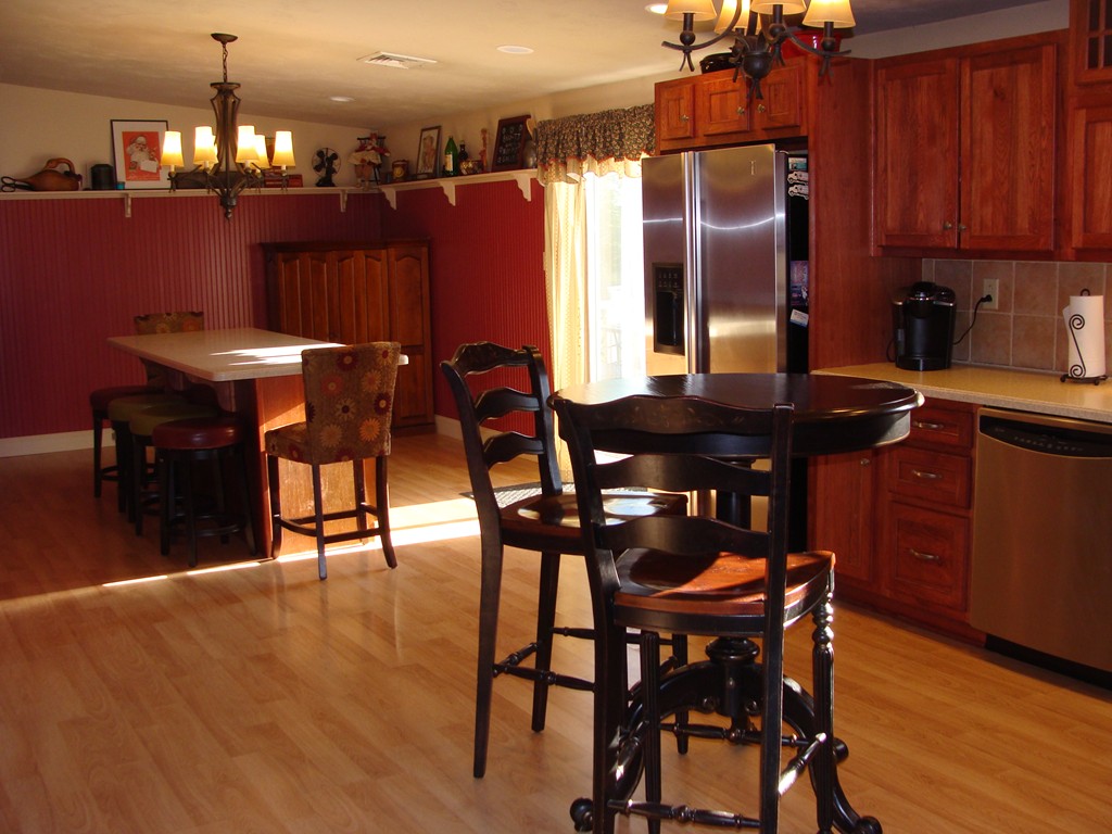 47 Henry Marsh Road Dudley, MA 01571 - Photo 6 of 30 a view of a dining room with furniture and wooden floor