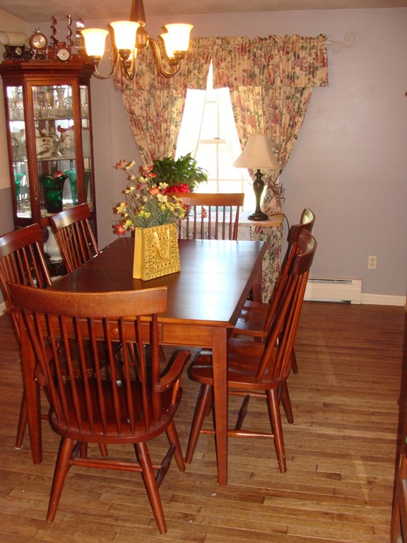 47 Henry Marsh Road Dudley, MA 01571 - Photo 7 of 30 a view of a dining room with furniture and wooden floor
