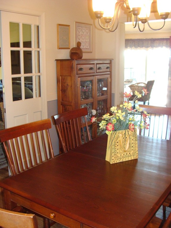 47 Henry Marsh Road Dudley, MA 01571 - Photo 8 of 30 a view of a dining room with furniture window and wooden floor