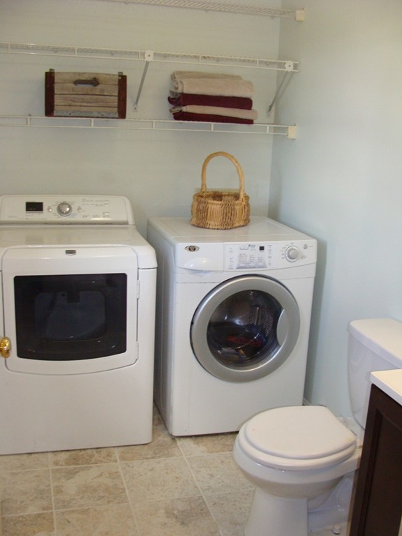 47 Henry Marsh Road Dudley, MA 01571 - Photo 10 of 30 a utility room with dryer and washer