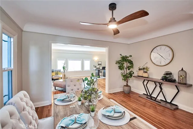 a white kitchen with a sink and cabinets