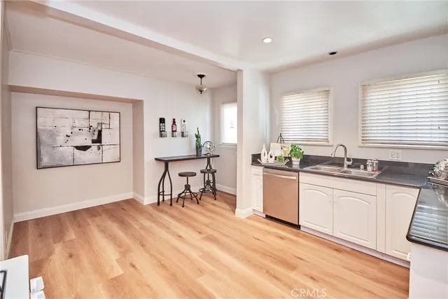 a bathroom with a toilet sink and shower