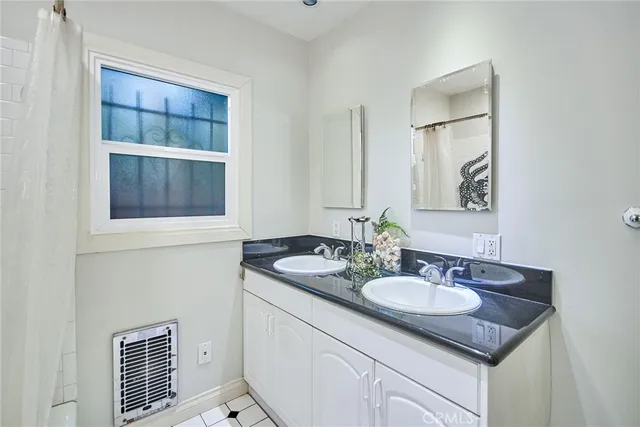 a view of a bathroom from a hallway