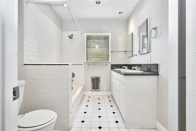 a view of a house with wooden fence