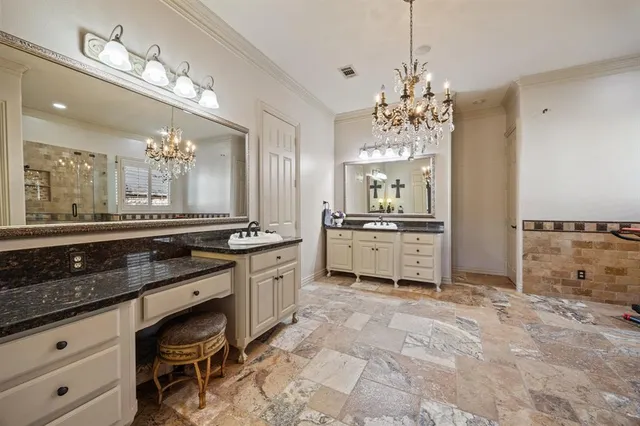 a large kitchen with kitchen island a sink stainless steel appliances and cabinets