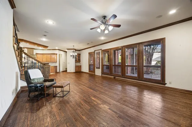 a view of livingroom with furniture wooden floor and windows