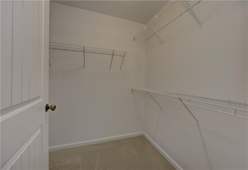 605 Summit Point Canton, GA 30114 - Photo 36 of 56 a view of a room with racks on the wall