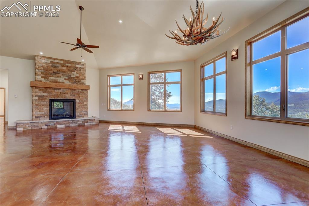 56801 US Highway 285 Bailey, CO 80421 - Photo 13 of 29 a view of an empty room with a window and fireplace