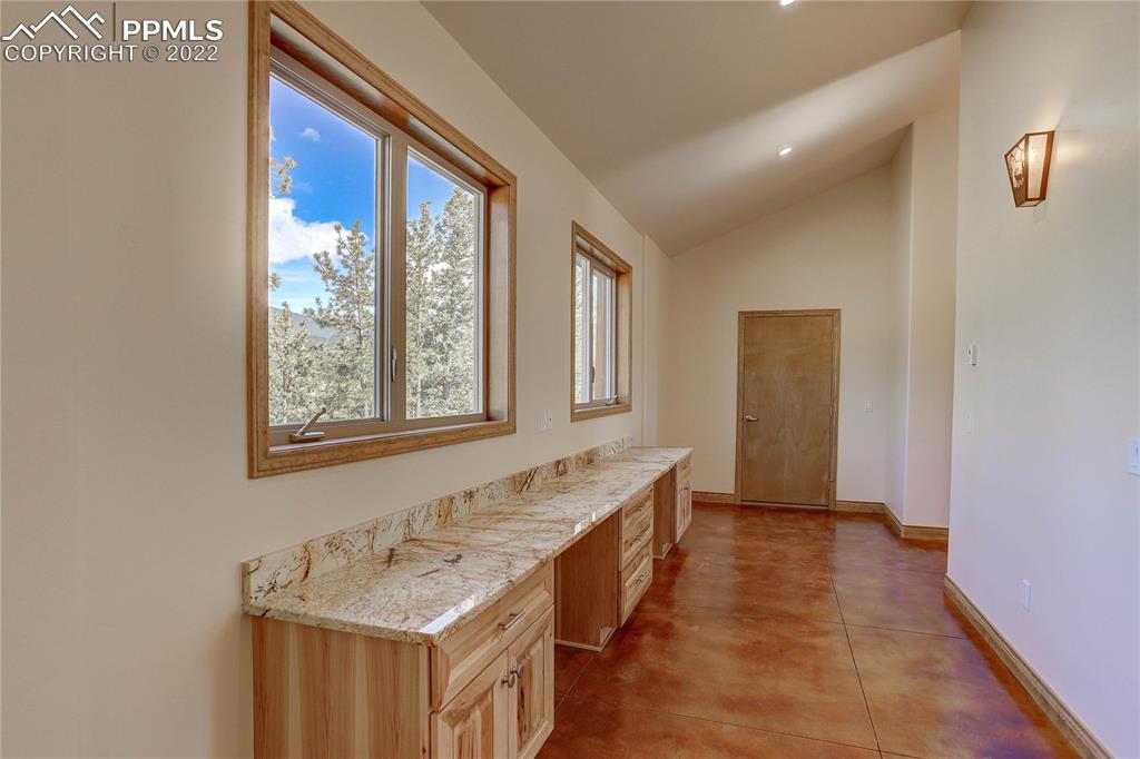 56801 US Highway 285 Bailey, CO 80421 - Photo 25 of 29 a bathroom with a granite countertop sink and a bathtub