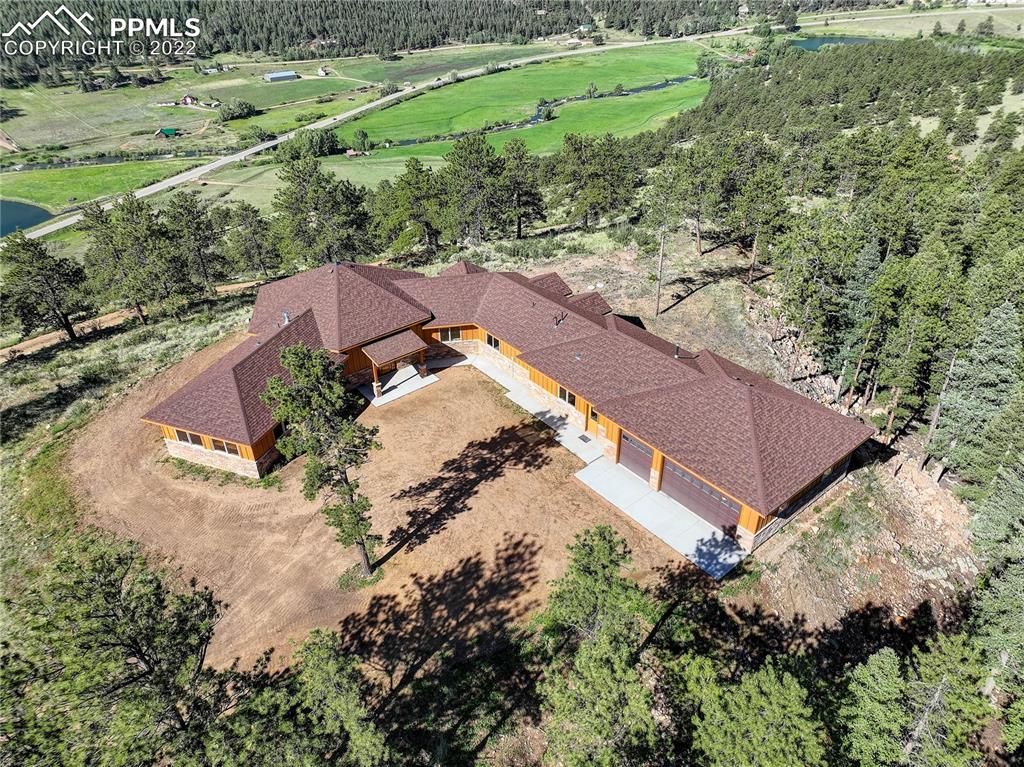 56801 US Highway 285 Bailey, CO 80421 - Photo 5 of 29 an aerial view of a house with a yard and trees