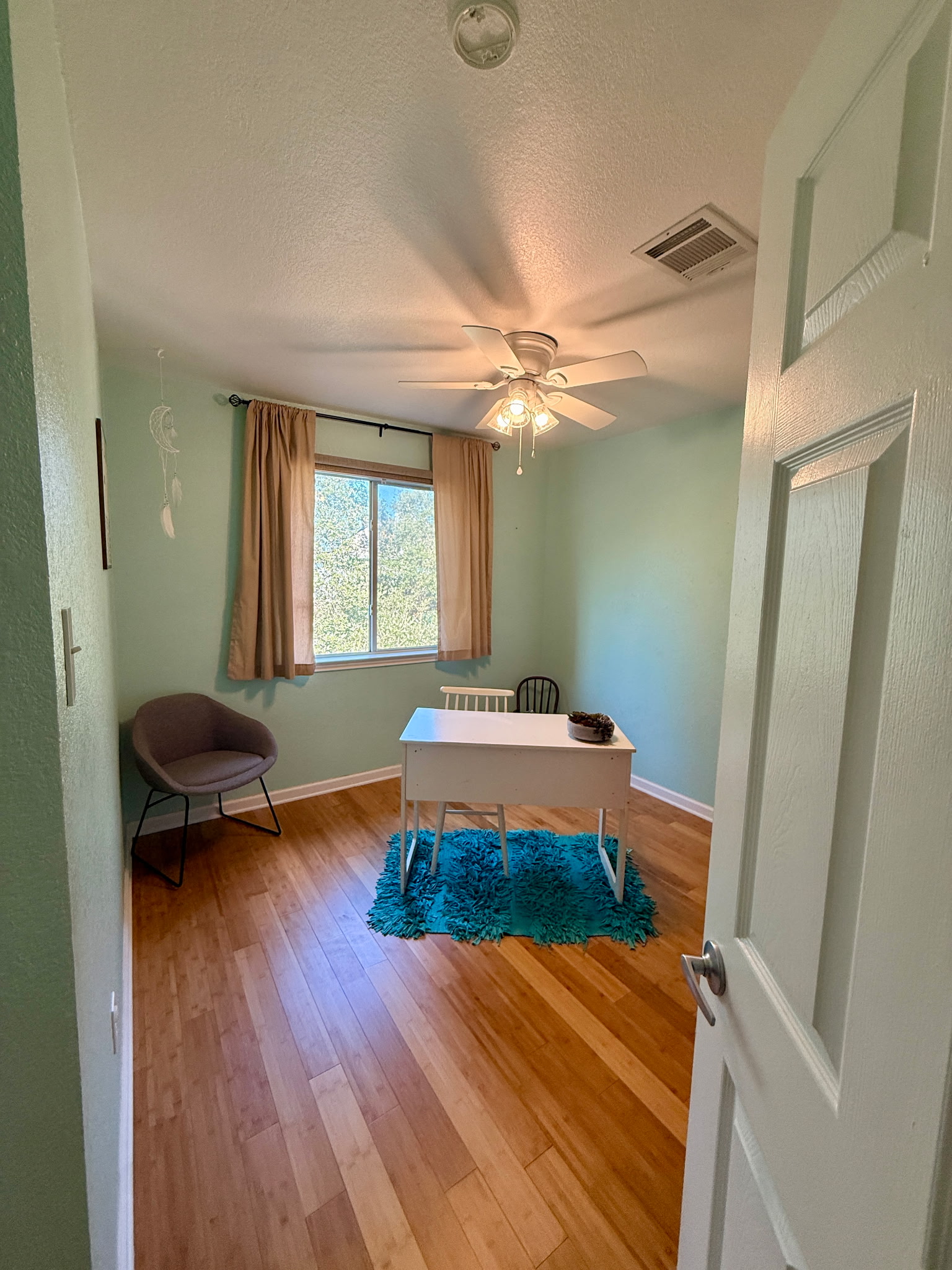 904 Double File Cove Round Rock, TX 78665 - Photo 23 of 25 Warm wood flooring and classic window views anchor this versatile secondary room.