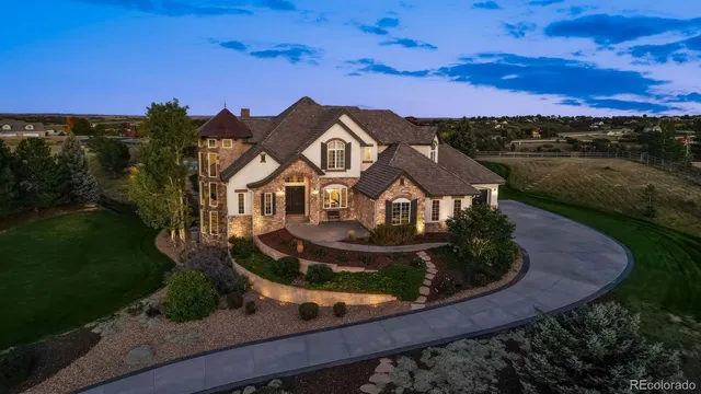 an aerial view of a house with a garden