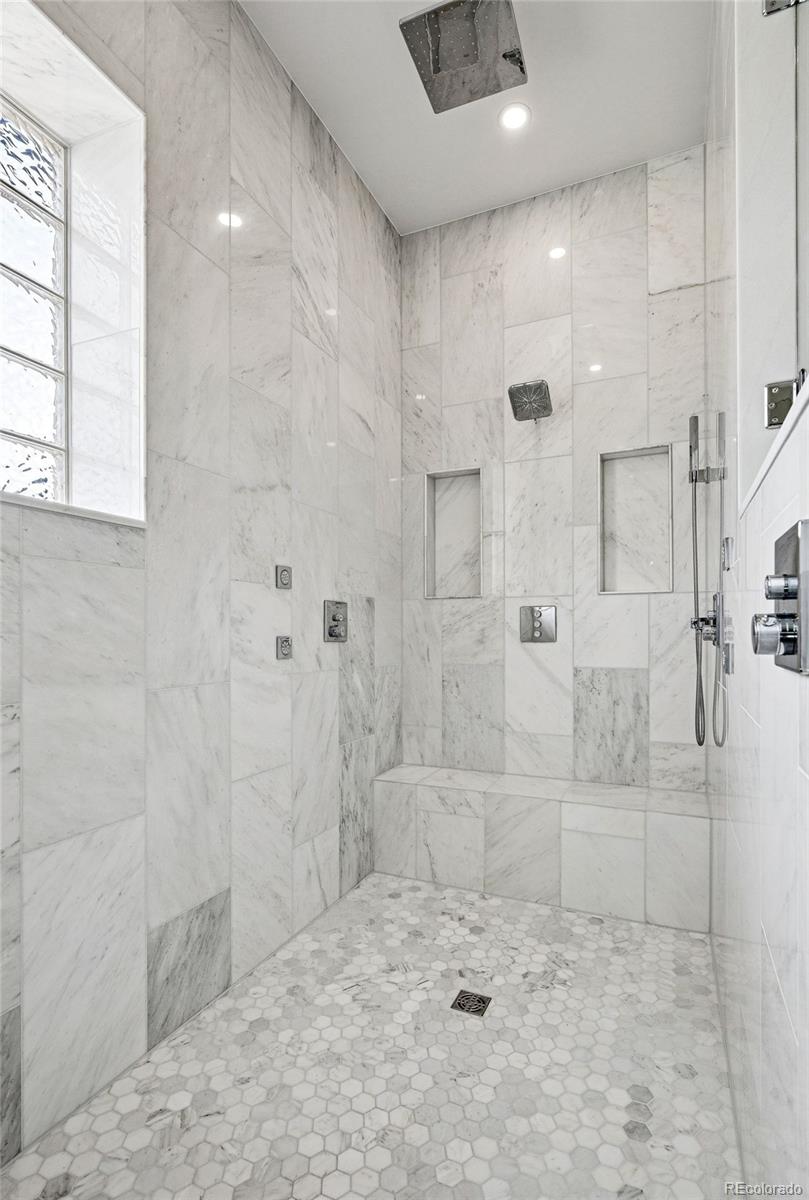 337 High Ridge Way Castle Pines, CO 80108 - Photo 26 of 50 a bathroom with a shower