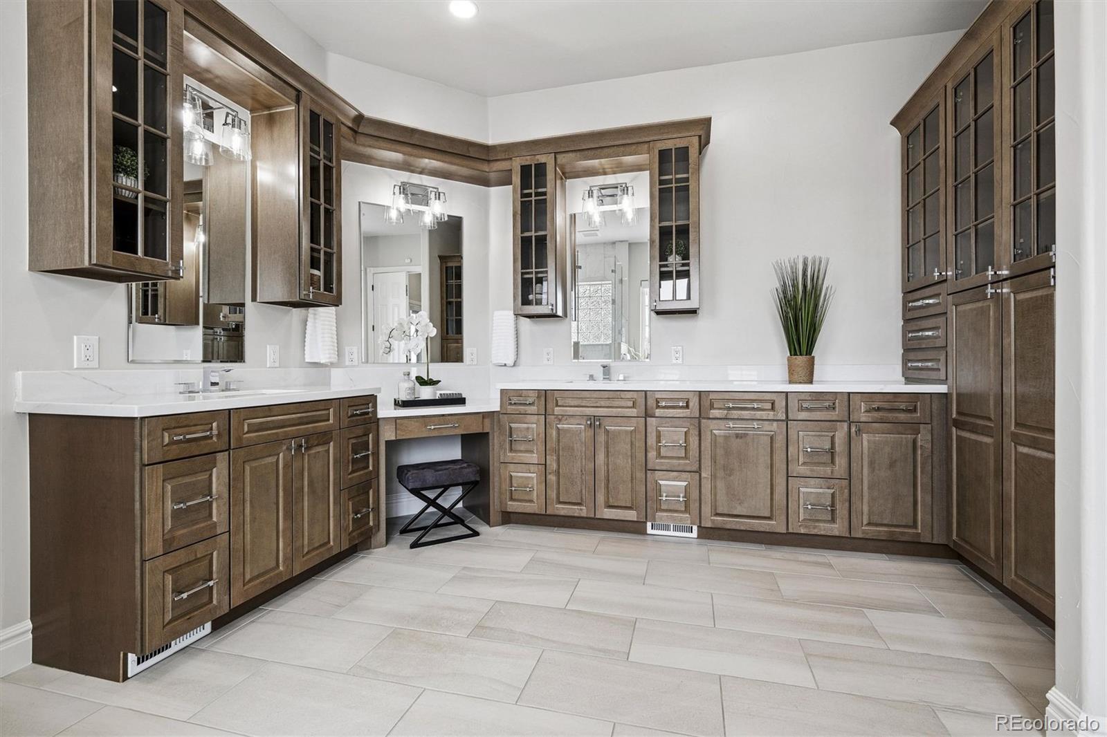 337 High Ridge Way Castle Pines, CO 80108 - Photo 27 of 50 a spacious bathroom with a double vanity sink a mirror a bathtub and shower