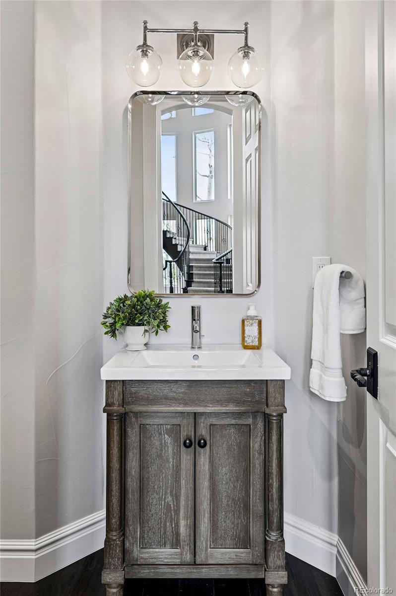 337 High Ridge Way Castle Pines, CO 80108 - Photo 30 of 50 a bathroom with a granite countertop sink and a mirror